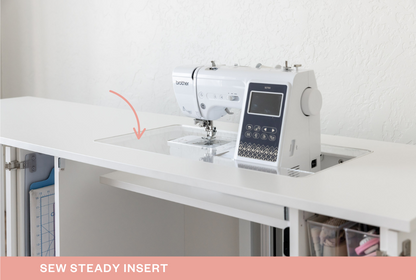 Sewing machine on a white table with text about a sew steady insert and deluxe package. [Deluxe]