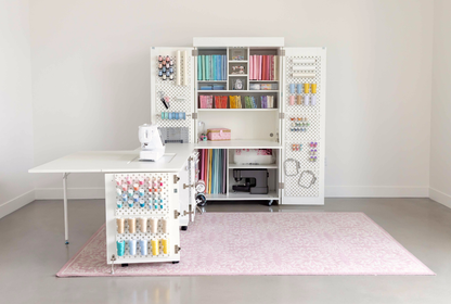 Craft room with a sewing table and storage cabinet filled with supplies [Deluxe]