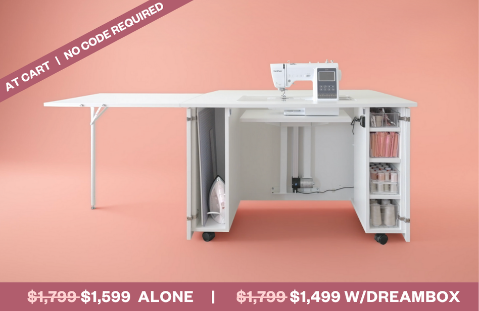 White sewing table with a sewing machine on a pink background [Standard]
