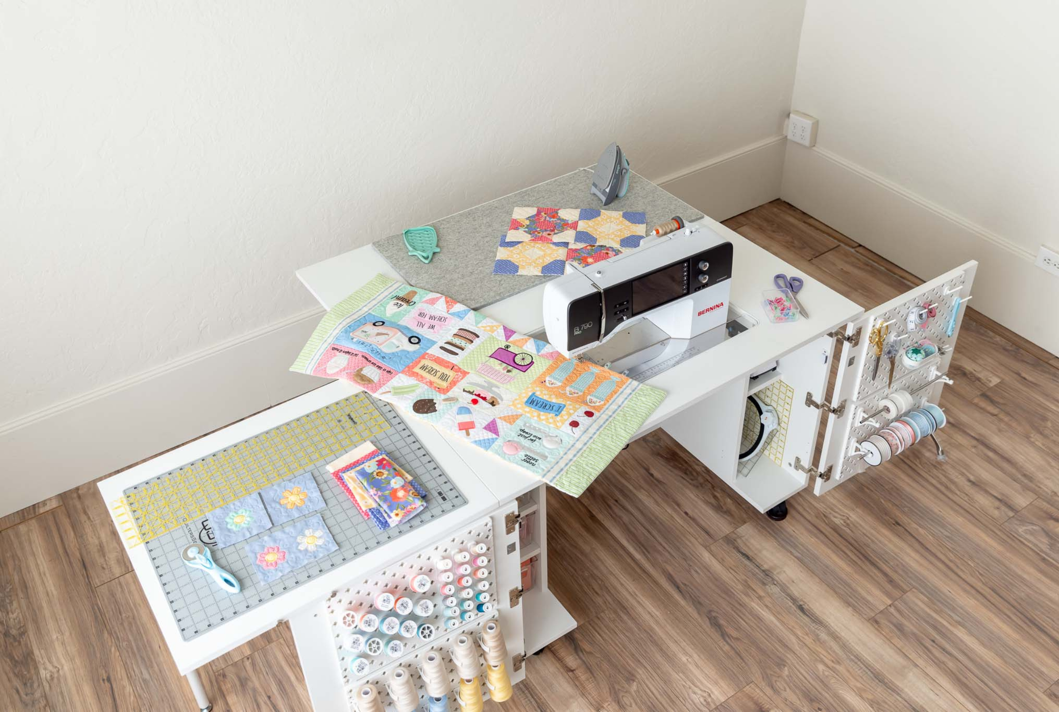 Overhead shot of sewing, ironing, and cutting materials [Deluxe] [Standard]