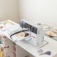 DreamStation - Overhead shot of sewing, ironing, and cutting materials [Deluxe] [Standard] - 27543963205694